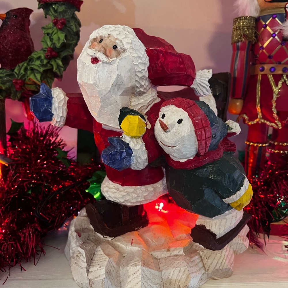 Santa and kid ice skating